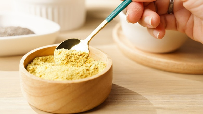 wood bowl of nutritional yeast
