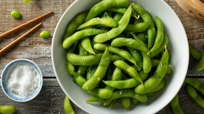 salted edamame in white bowl