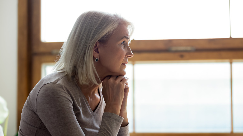 woman depression window