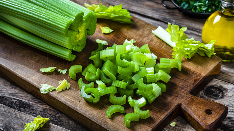 chopped celery on a cutting board