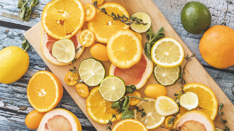 Citrus fruits on cutting board