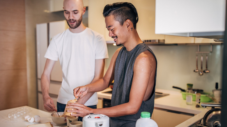 Two men cooking with peanut butter