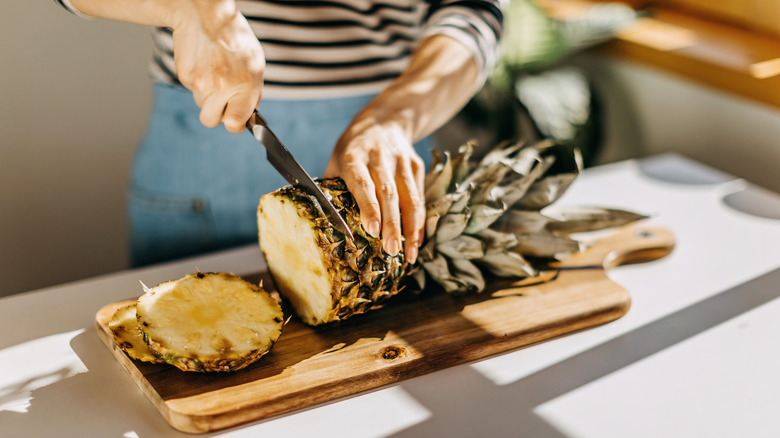 Cutting a pineapple