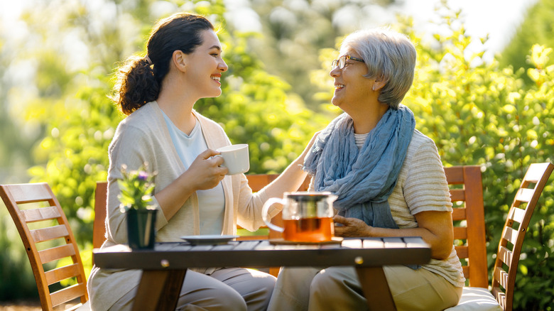 two women drinking tea together