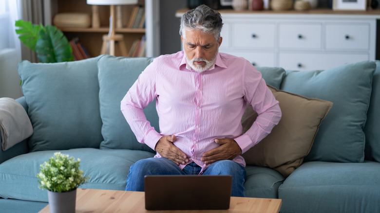 Man holding his stomach