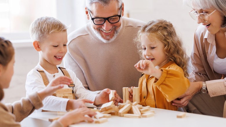 children playing with grandparents