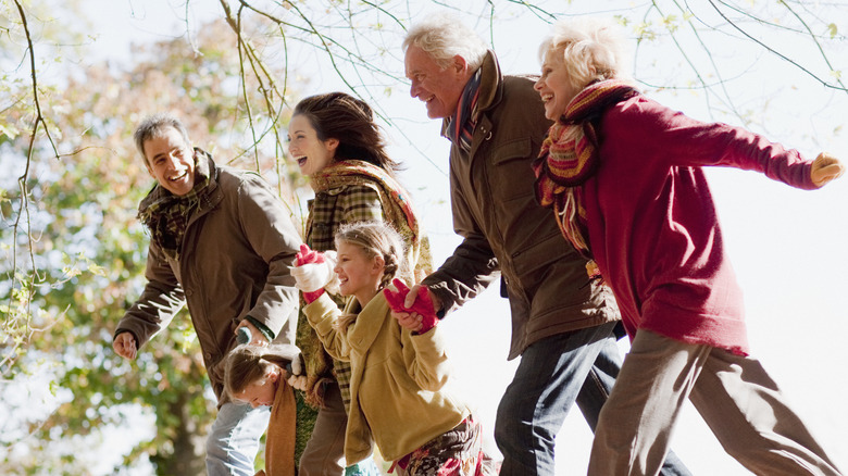 healthy multi-generational family walking outdoors