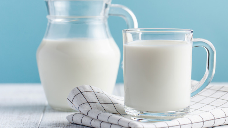 Hemp milk pitcher with blue background