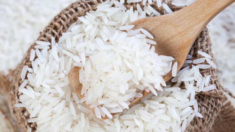 rice scooped with wooden spoon