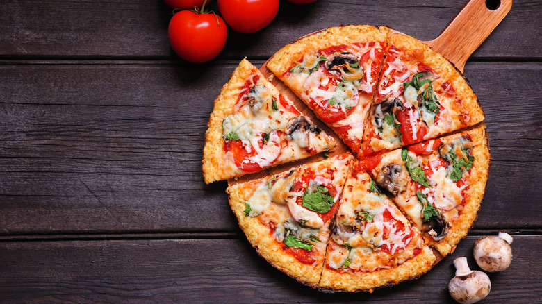 Vegetable pizza on wooden surface