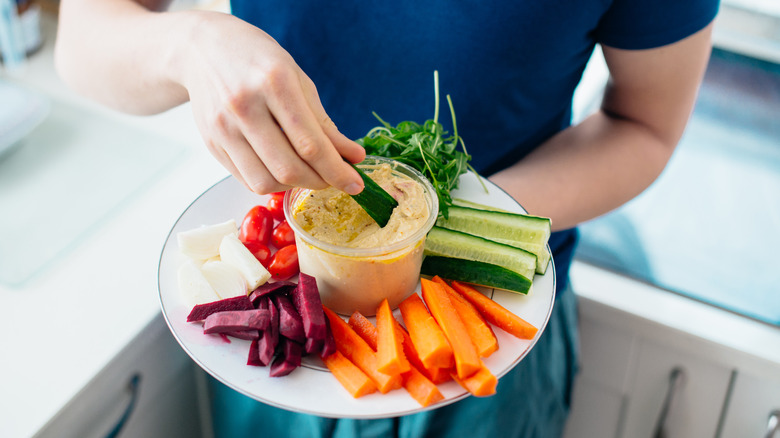 Hummus and veggies on plate