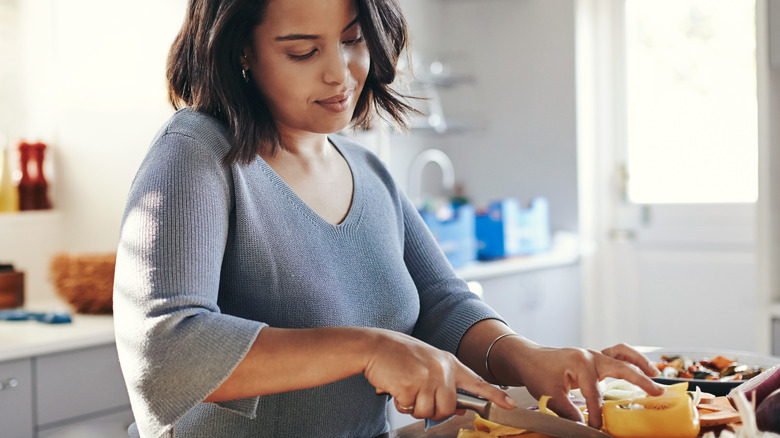 Woman cooking a meal at home