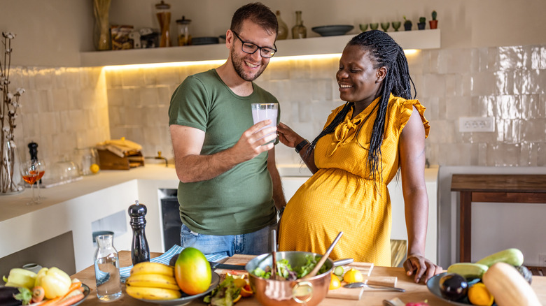 pregnant woman preparing healthy gluten-free meal