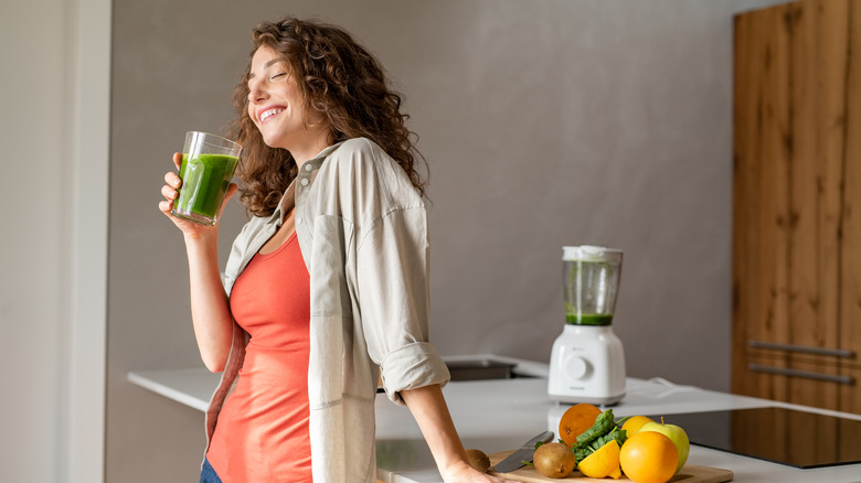 woman drinking smoothie