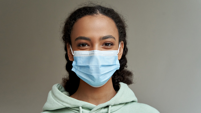 teenage girl wearing mask