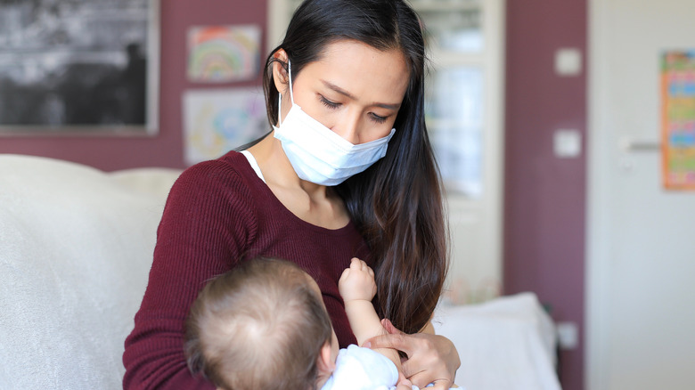 masked mom and infant