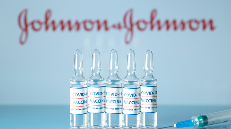 Johnson & Johnson logo and vaccine vials