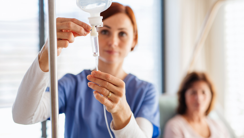 woman at hospital, saline drip