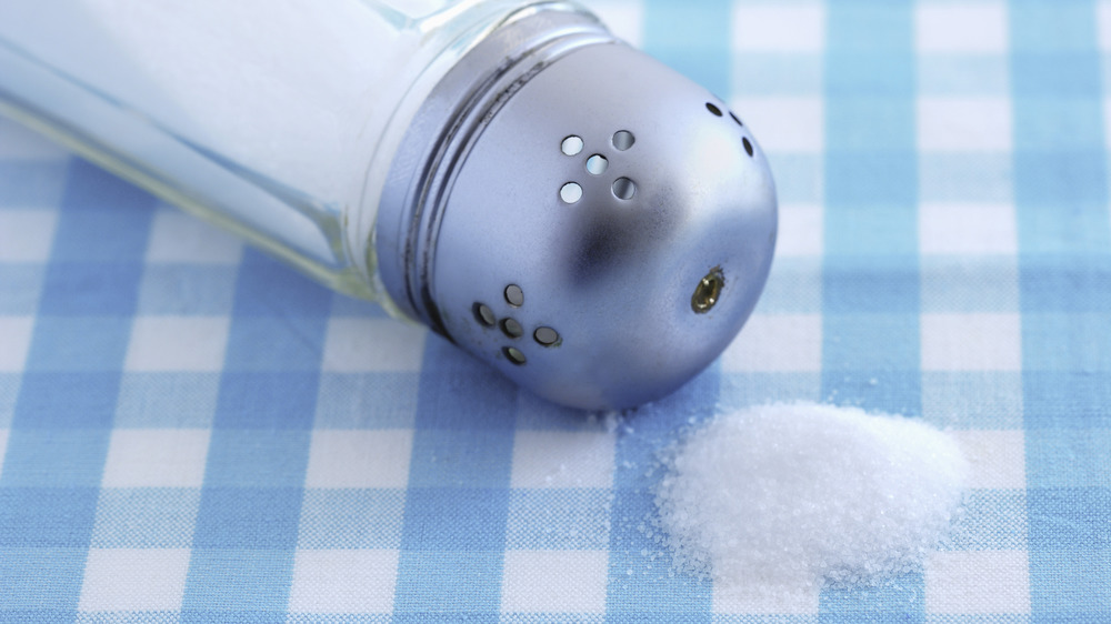 spilled salt shaker gingham tablecloth