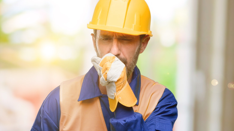 Construction worker coughing