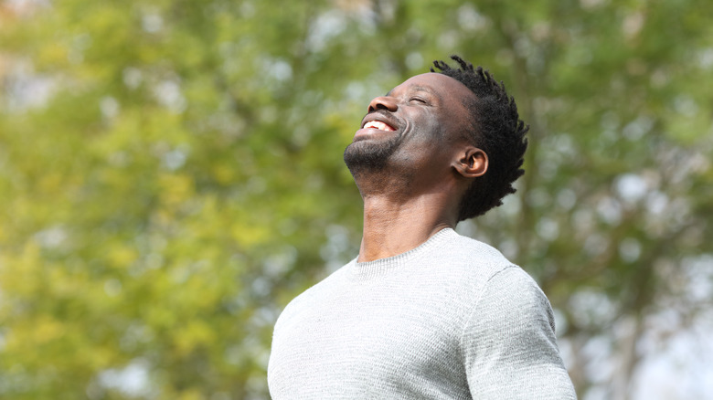 Man breathing fresh air