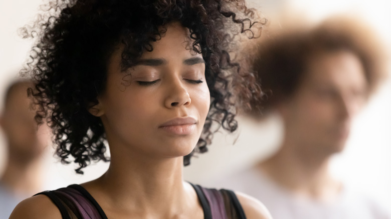 woman with eyes closed at peace