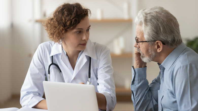 Man consulting with doctor