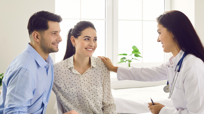 couple having pleasant doctor's consultation