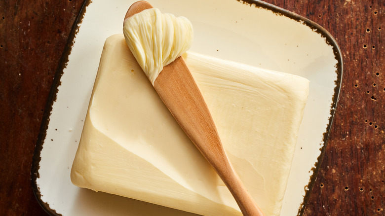butter with wooden knife