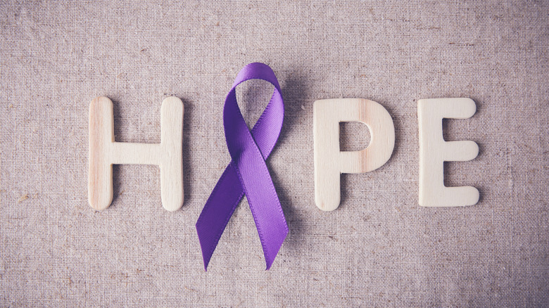 The word hope with purple ribbon