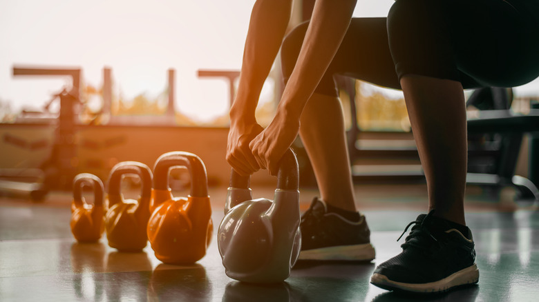 person with kettlebell