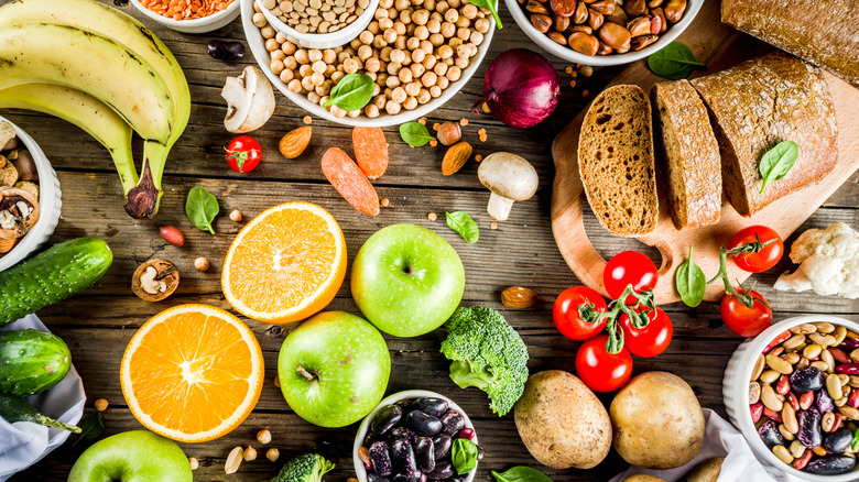 fruits, vegetables, whole grains on a wooden table