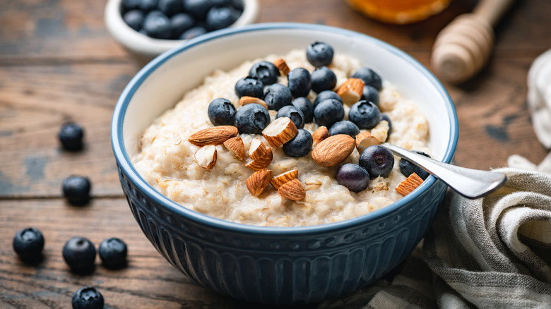 bowl of oatmeal with almonds and blueberries