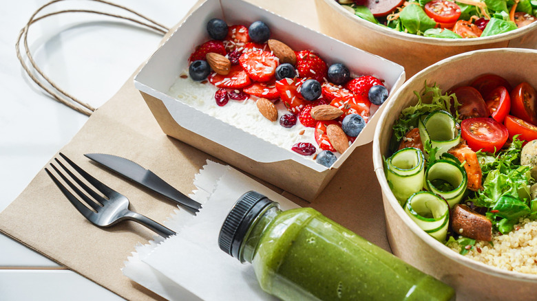 meal prepped foods on white background