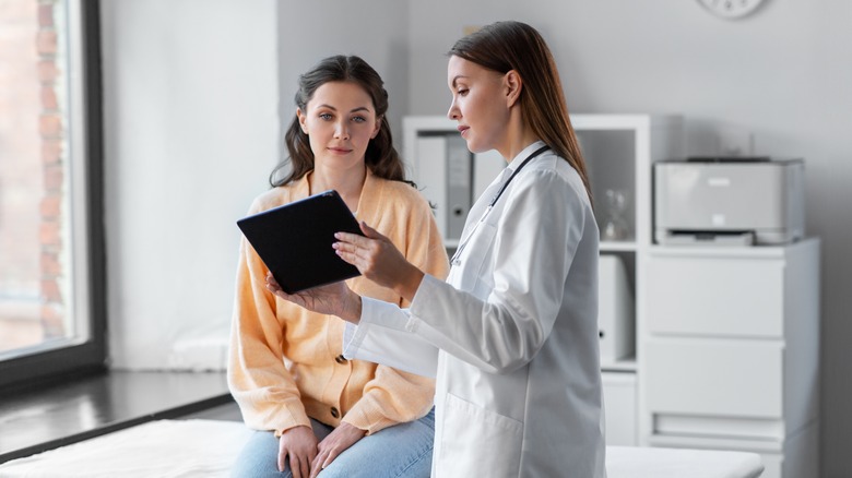 Physician speaking with female patient