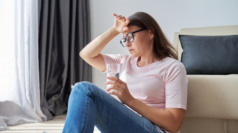 Distressed woman having hot flash