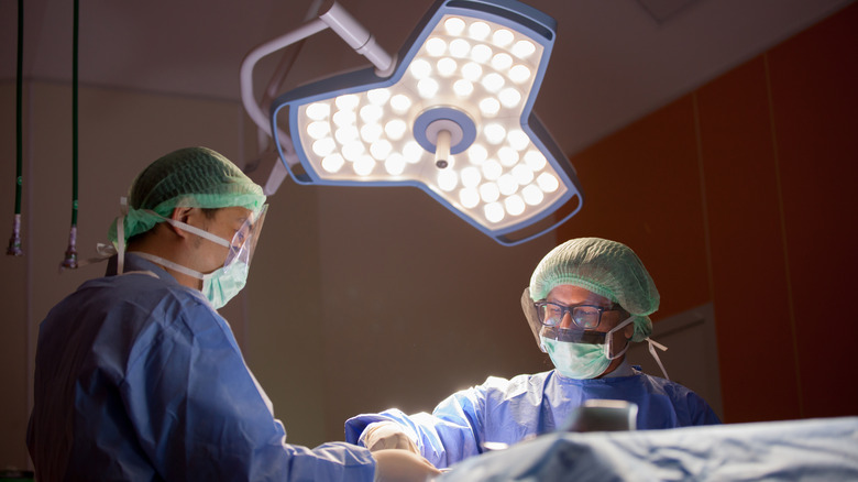 Physicians performing surgery