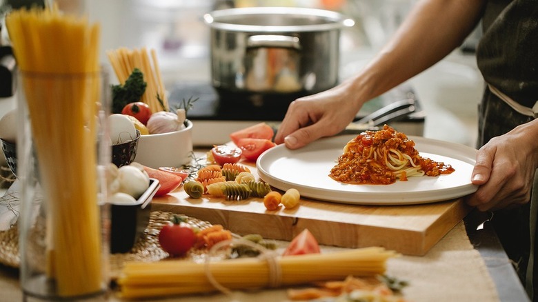 Person making spaghetti