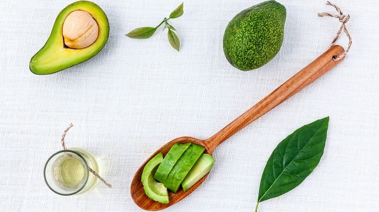 Avocado and wooden spoon