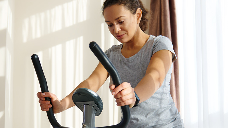 Woman on cycling machine