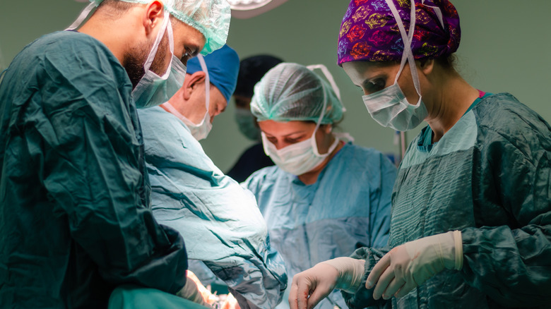 Surgical team performing operation