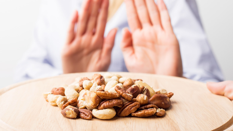 woman refusing tree nuts