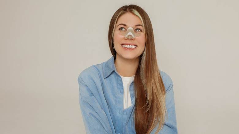 A woman recovers from a nose job