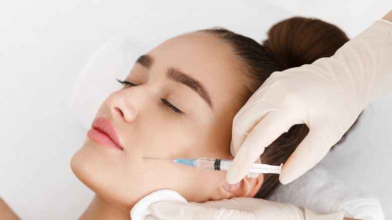 A woman gets a Botox injection