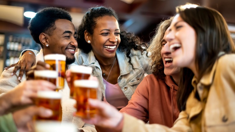 Friends sharing drinks at restaurant