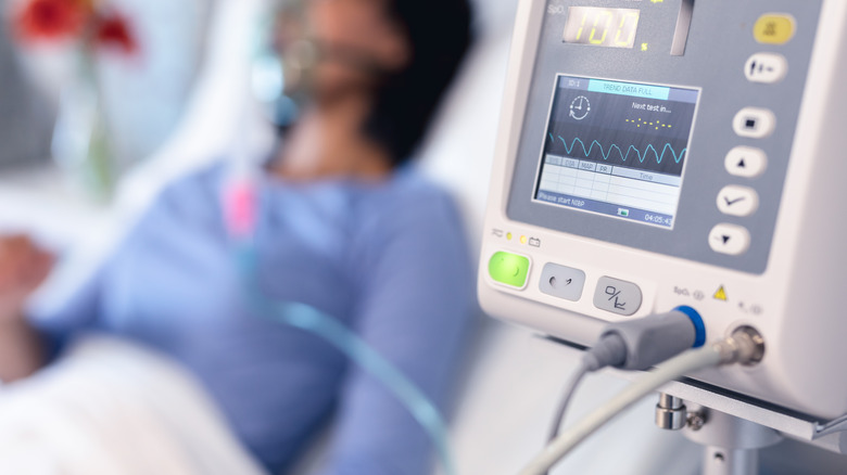 Patient in hospital bed.