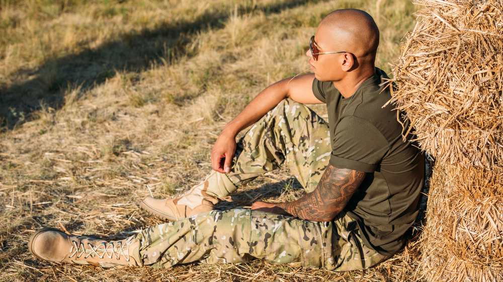 soldier with sleeve tattoo