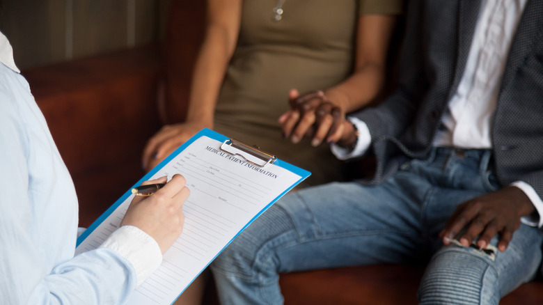 Couple sitting in a doctor's office