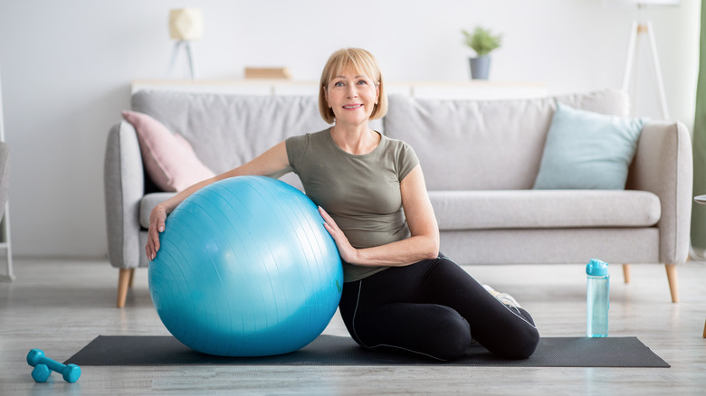 woman with pilates ball