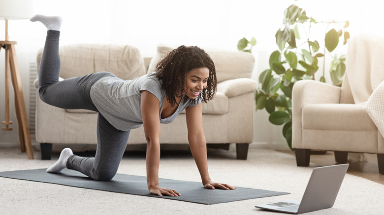 woman doing pilates at home